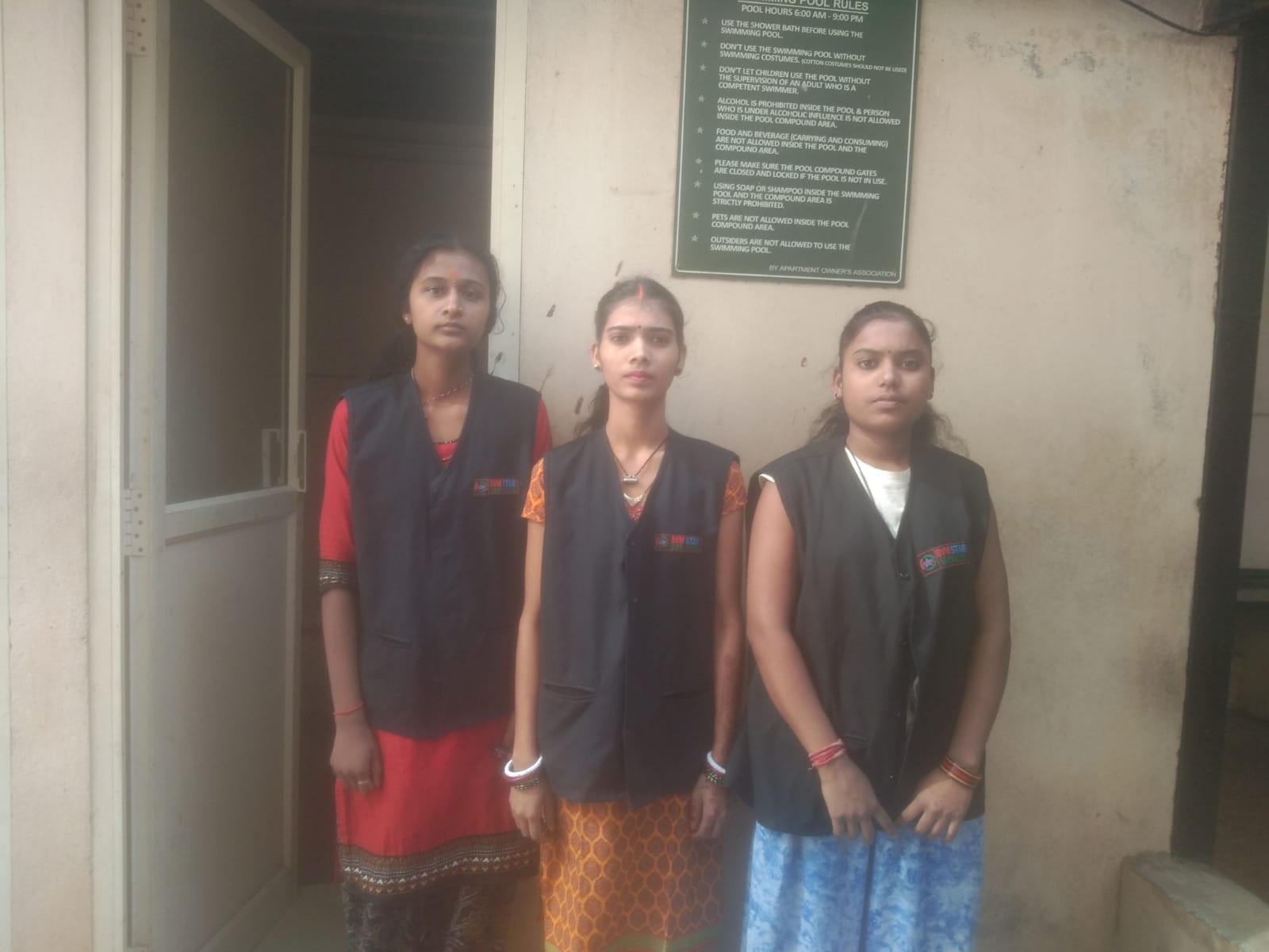 NV House Keeping Services staff in branded vests at a client site
